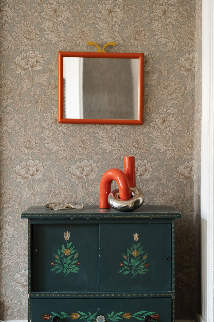 the dog\2\17;s gear is kept near the entry in an antique swedish chest.  21