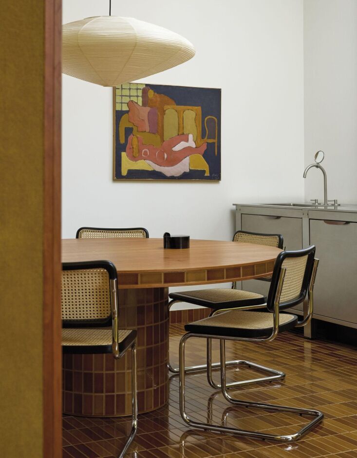 tile from the excinere collection is implemented as flooring and dining table.  18