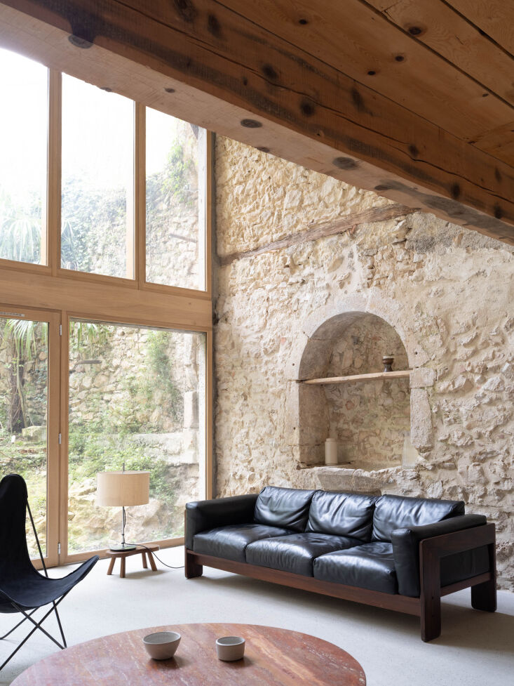 the sofa is a bastiano sofa by tobia & afra scarpa with jorge ferrari hardo 25