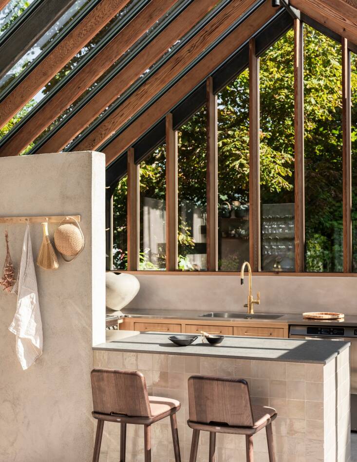 the peninsula abuts a half wall that separates the cook space from the rest of  19