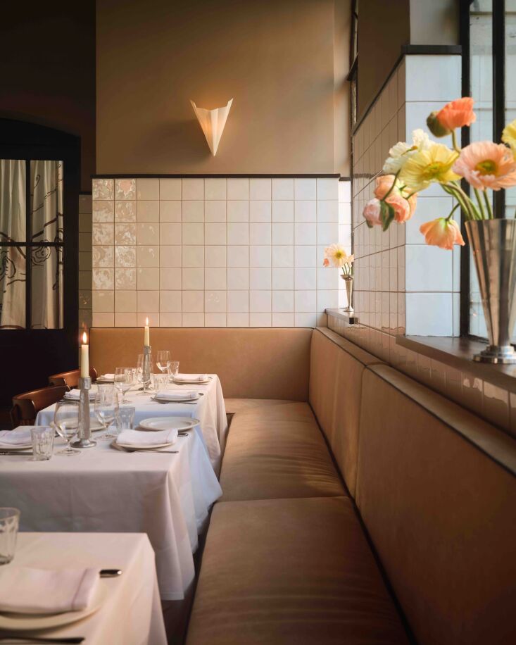tables are designed with linoleum pieces—the tables are intentionally undone  22