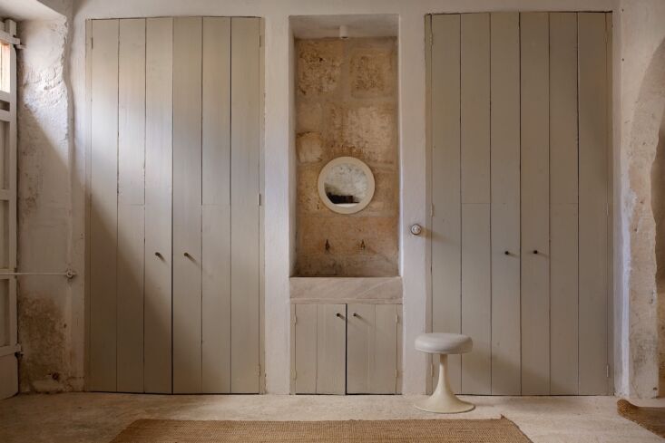 in the adjacent workroom, paneled doors (built by colin and a friend) conceal t 23