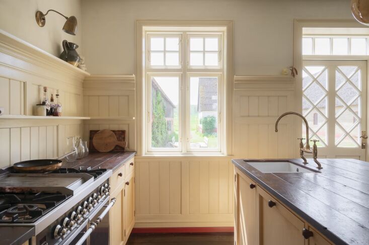 the wood countertops are old wooden floor planks from the \1800 century finishe 19