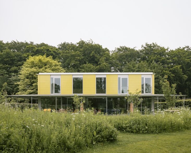 the two story structure has a modular, industrial steel frame and a surprise ex 17