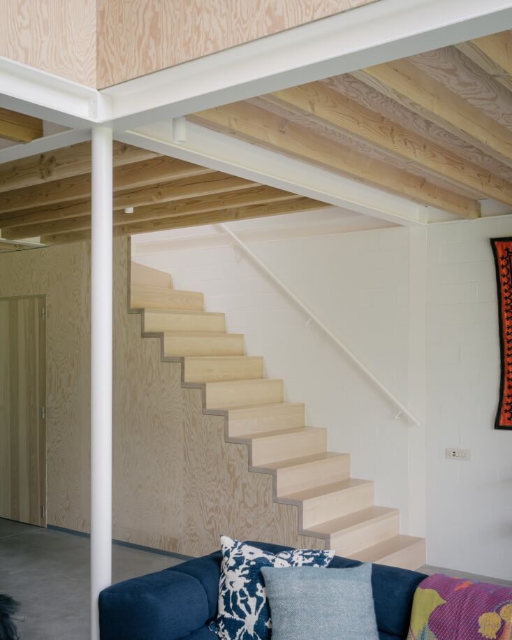 a sculptural open stair leads to two bedrooms, an office/child\2\17;s ro 23