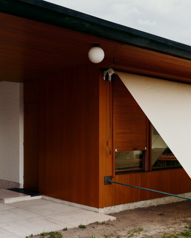 an orb surface mount light above aalto\2\17;s inventive exterior window 30