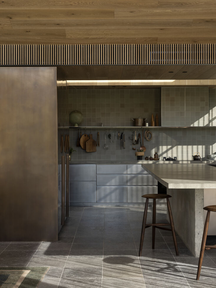 the kitchen cabinets are made of orbital brushed stainless steel sheeting. the 23