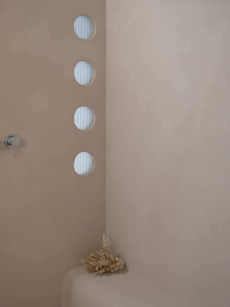 simple niches house led lighting behind textured glass. the walls are finished 28