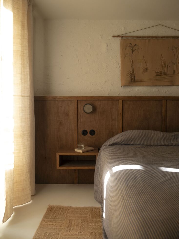 a built in headboard and bedside table, also by charly. the curtains are a mix  20