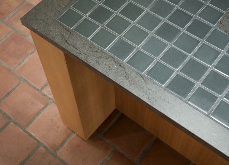 the kitchen island is framed with balsaltina, a fine grained gray italian volca 23