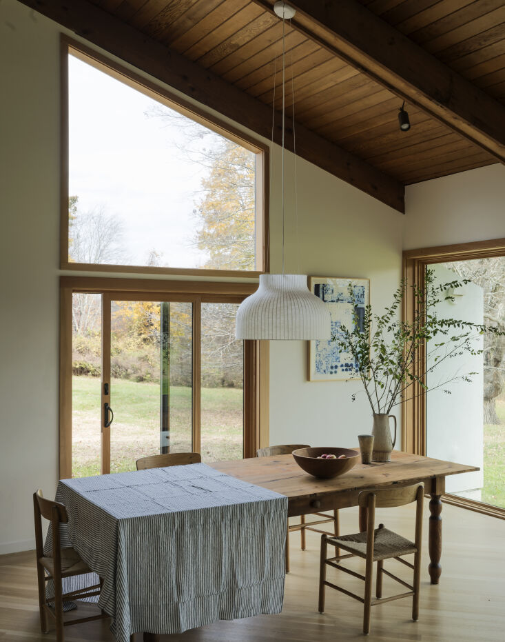mutto\2\17;s strand open pendant light hangs over an antique farmhouse t 24