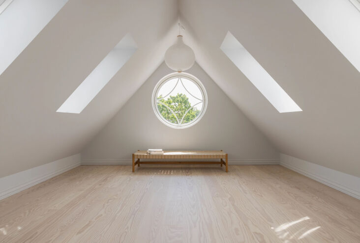 the attic level, too, was fully renovated. the circular window was an original  26
