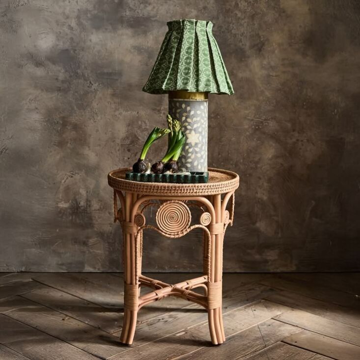 woven in the philippines, the calista rattan side table, \$479, is part of the  18