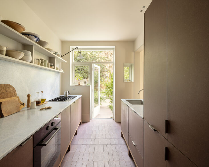 the couple opted for brick colored valchromat cupboards with walnut feet, & 24