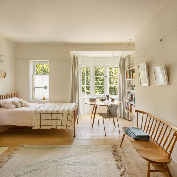 the couple\2\17;s daughter sleeps in a vintage spindle back ercol bed th 29