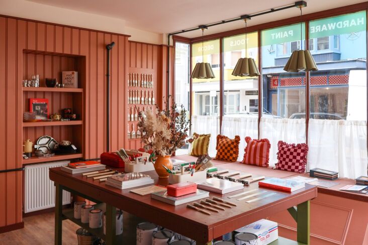 the shop came with its beadboard paneling and window seat. emma built the displ 20