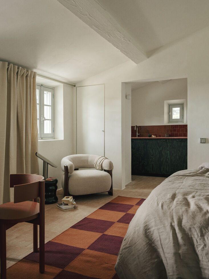in the main bedroom suite, a nordic knots square flatweave rug, another serax p 26