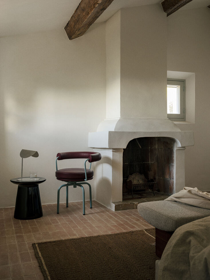 another bedroom designed with a charlotte perriand fauteuil tournant chair for 29