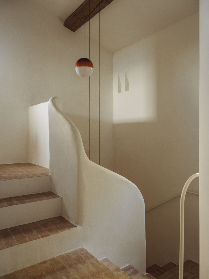 the dipping light pendant in amber designed by jordi canudas for marset hangs i 30
