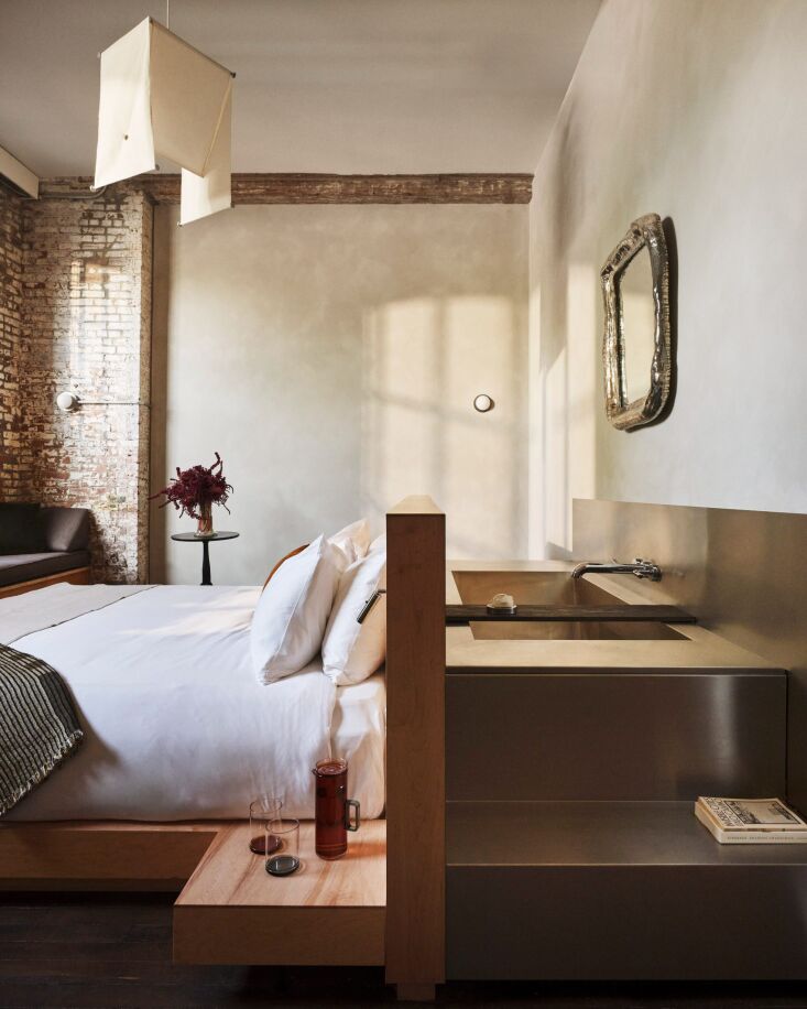rooms feature exposed brick, limewashed walls, maple platform beds, and built i 22