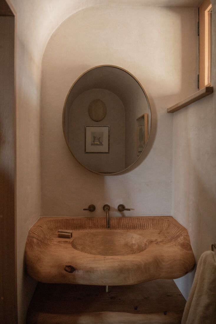 a hand carved wood sink made from macracarpa/monterey cypress sourced from dev 30