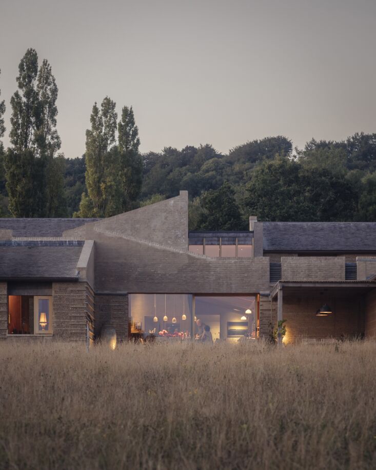 rammed earth is pared with oak, limestone, clay plaster, and copper with interi 33
