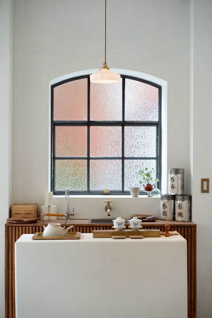 under a custom black steel window, homework built a tea making area: \2\ 24
