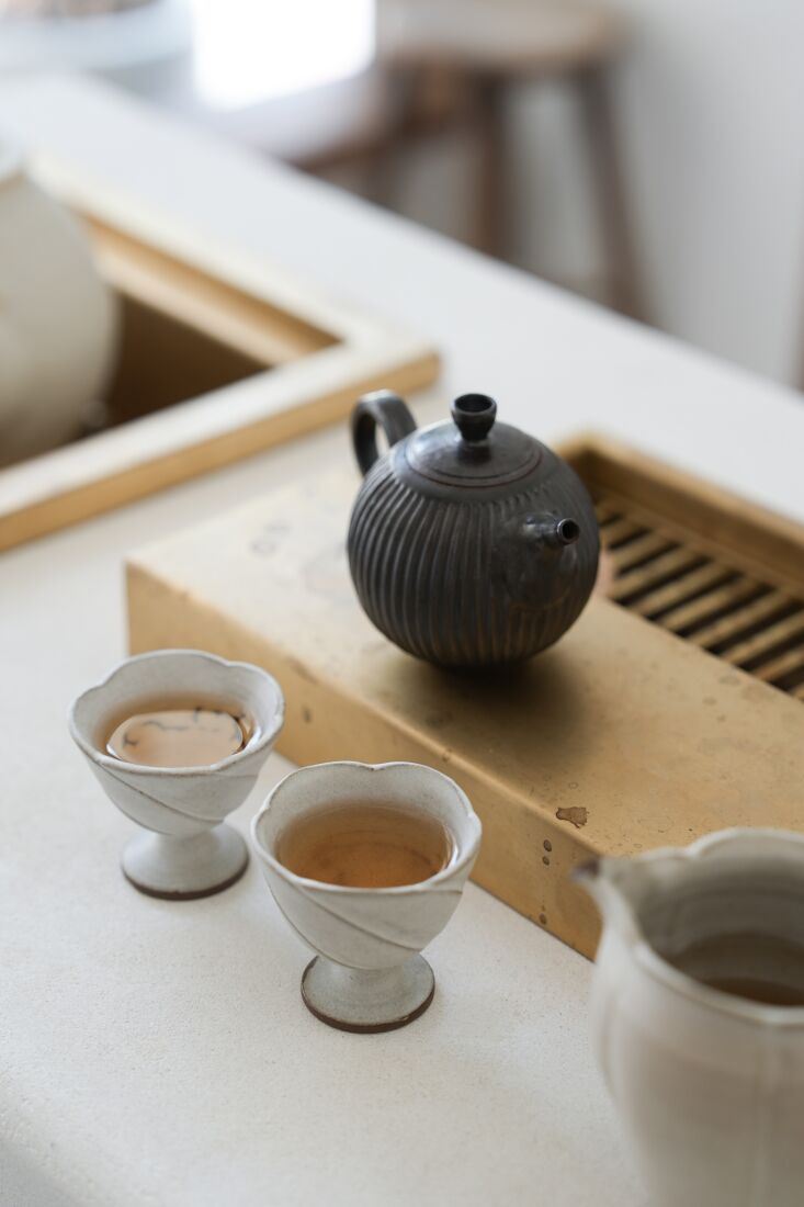 flower shaped teacups and a fluted teapot. photograph courtesy of wolf tea. 26