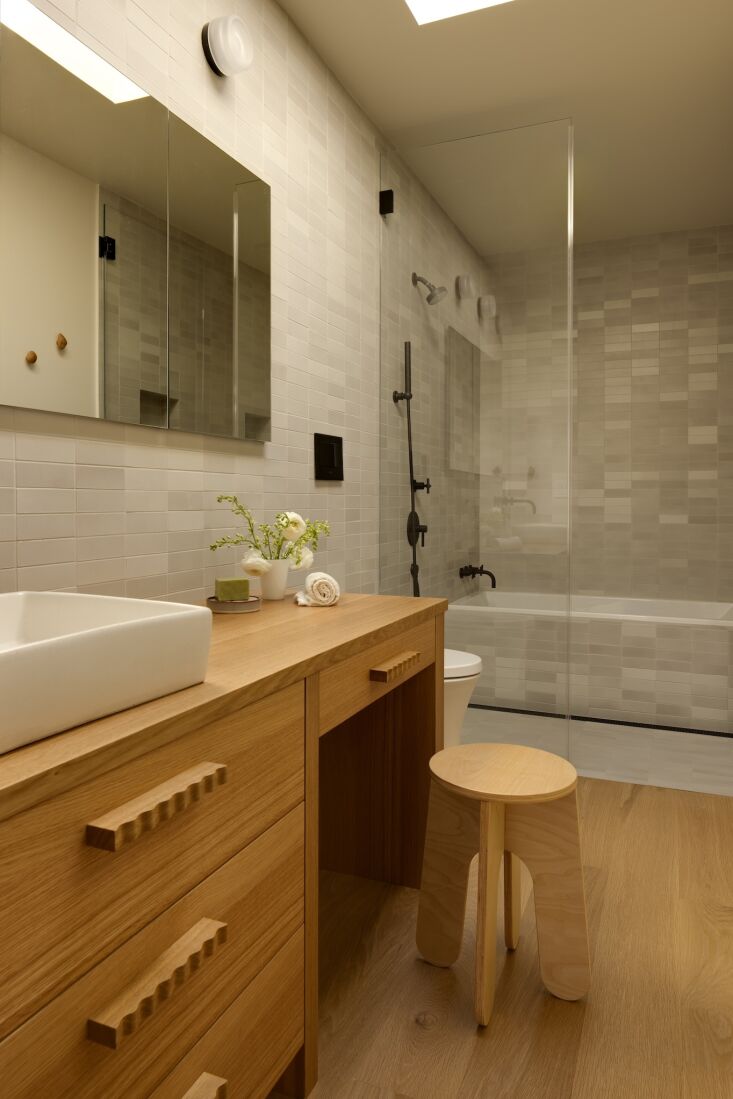 above: inspired by a hotel sink vanity, kate requested a place to sit and get r 32