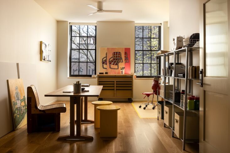 a flight dining table and field stools from sundays are used for meetings with  24