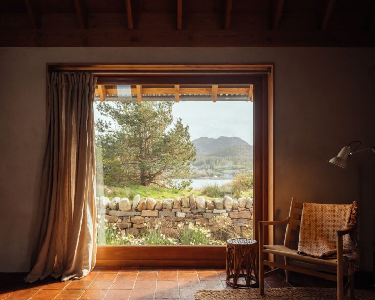 a single large east facing window is angled to catch the low morning sun and fr 24