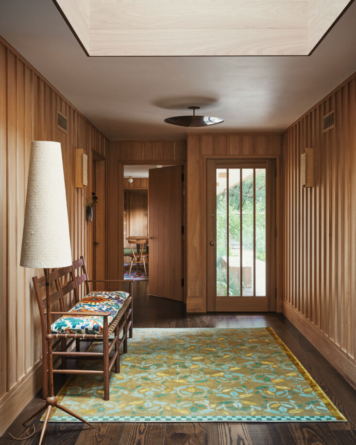 the entry is defined by the bean rug by commune for christopher farr, a windham 19