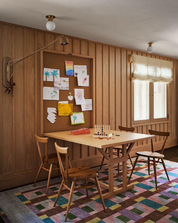 a game table designed in house and built by louis ptak is accompanied by the cr 25