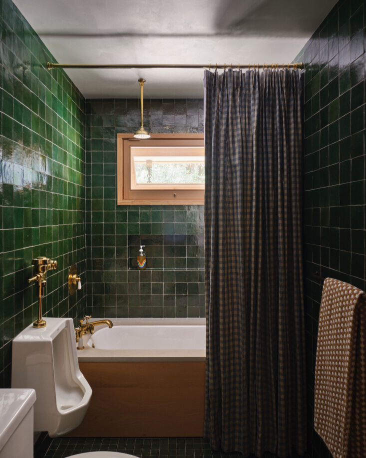 green zellige tiles in the bath fitted with barber wilsons brass fixtures. 28