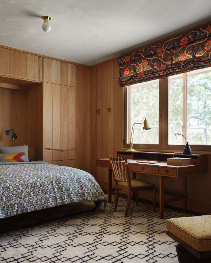 in a home office space that doubles as additional guest room with a custom murp 34