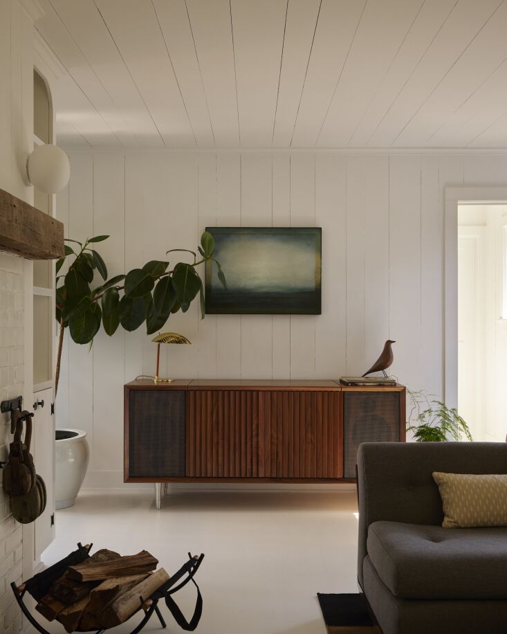 a wrensilva m\1 record console is paired with a a curated collection of vintage 25
