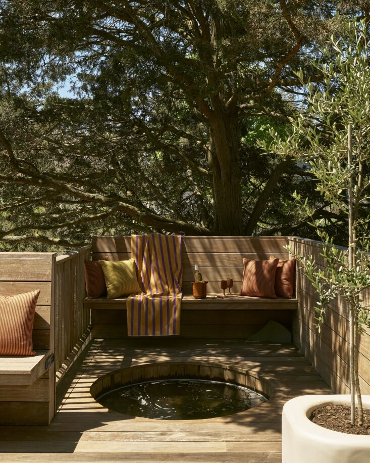 a hot tub, a dusen dusen striped beach towel, and maharam concord stripe indoor 32