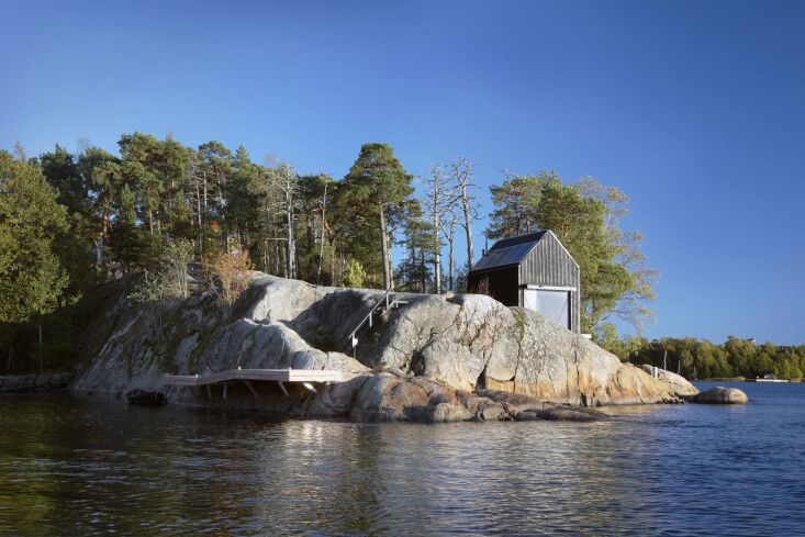 one of four cottages on the rocky outcropping. the buildings use a patented des 17