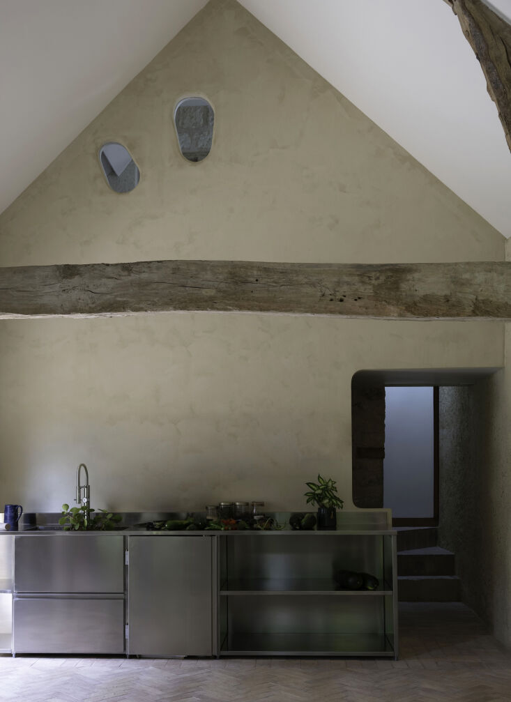 finishing some walls in plaster allowed for creative organic forms—at top—a 23