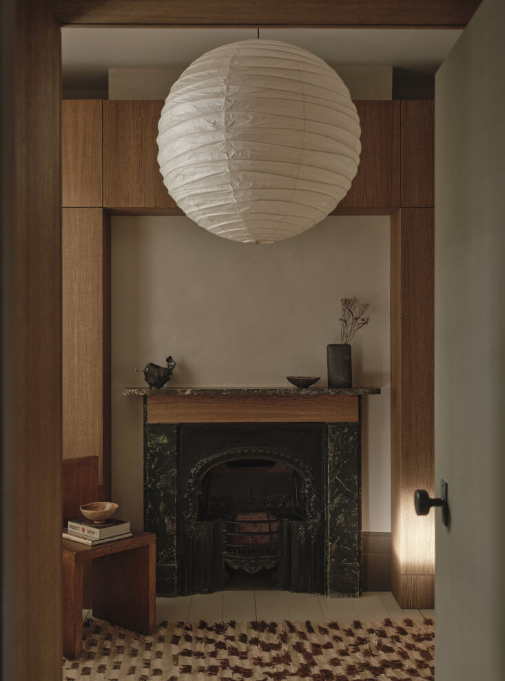 in the dressing room, an original painted plaster fireplace is patched with a p 23