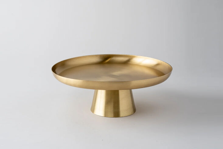 a brass cake stand made in india with a matte finish; \$49 at june home. 27