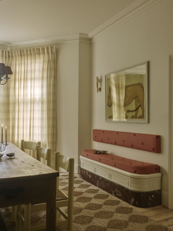 an antique cinema bench was reupholstered in le podge ketchup, part of côte de 26