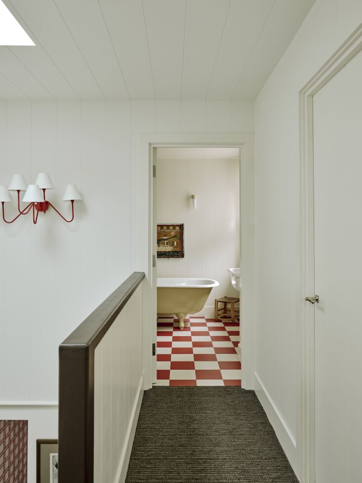 a jean royère style sconce leading into the children\2\17;s bath. 39