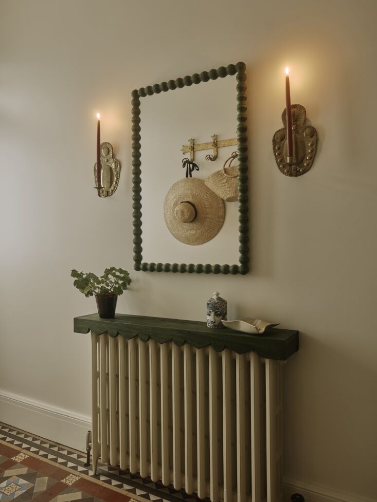 a custom shelf by winney woodwork was made to match the finish of a mirror by a 19