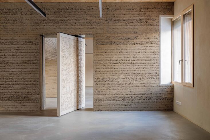 the versatility of rammed earth construction exemplified in a pivot door. 21