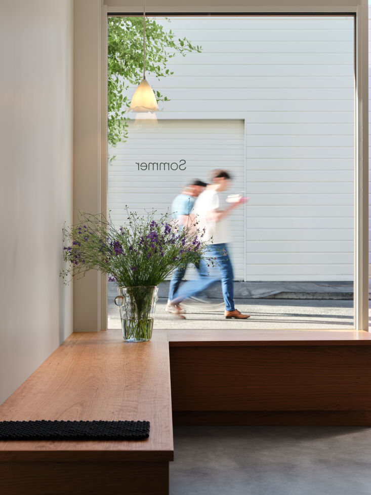 hanging in the window is a pendant by danish glasssmith silje lindrup. 18