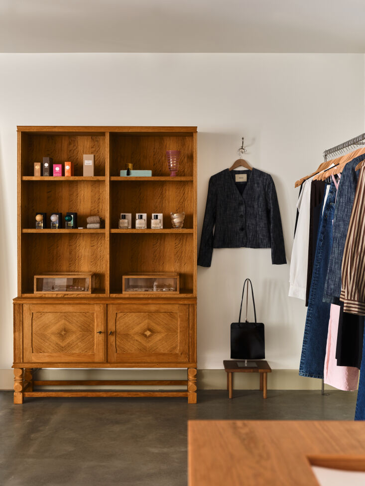 fragrance and jewelry are housed in a vintage danish piece sourced from far out 24