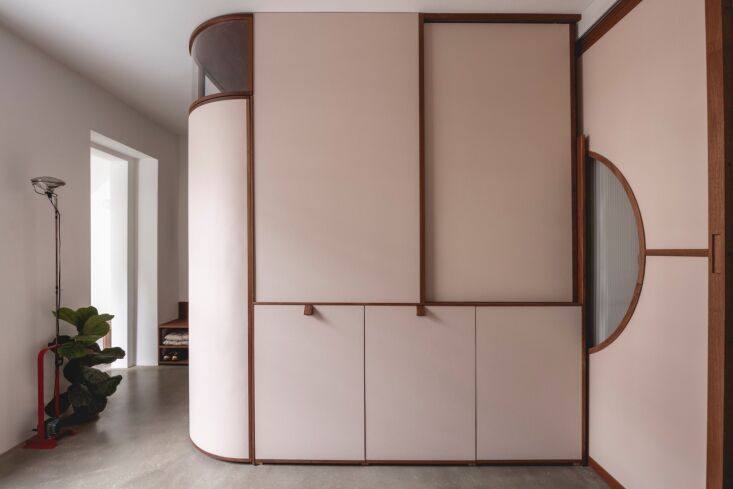 sliding walls allow the apartment to shift between one generous living space an 27