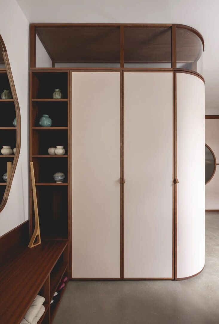 integrated storage houses everything from ceramics on display to entryway shoes. 31