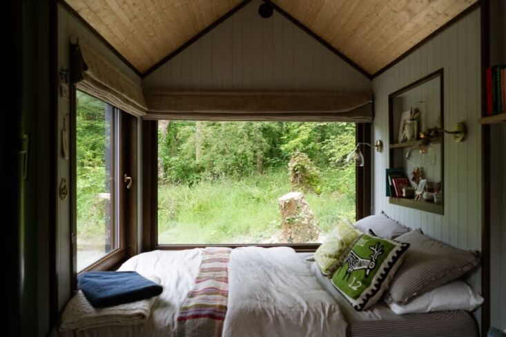 a bed with a view. the owner\2\17;s auntie anne made many of the cushion 31